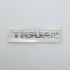 Купити Емблема - напис "TIGUAN" (рівна) скотч 168х26 мм 2008-2012 (wiwo 5HO 853 687A 739) 22238 Емблема напис на іномарки