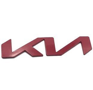Купити Емблема напис Kia NEW Червона 150x35 мм металева на скотчі (заводська) 88579 Емблема напис на іномарки