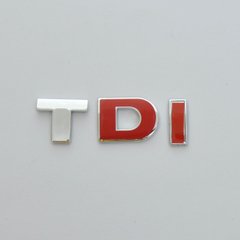 Купити Емблема - напис "TDI" (червона) пластик скотч 82х26 мм (Туреччина) 22192 Емблема напис на іномарки