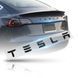 Купить Эмблема надпись Tesla глянцевая Черная Пластикна скотче 476 &times; 20 мм (OEM 1880160-00-A) 88386 Эмблема надпись на иномарки