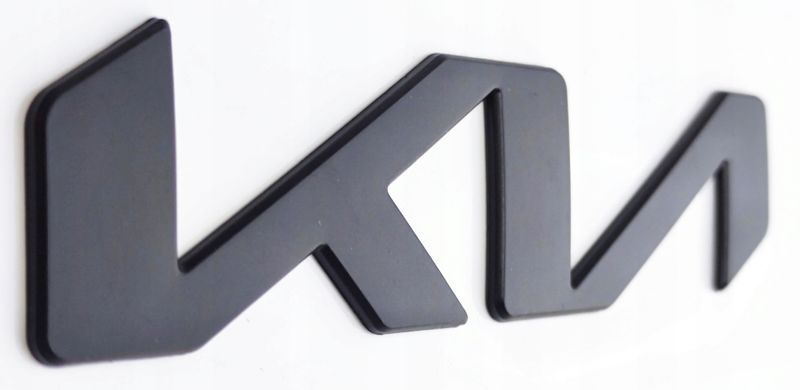 Купити Емблема напис Kia НОВА Чорна матова 130x30 мм металева на скотчі (заводська) 88587 Емблема напис на іномарки