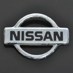 Купити Эмблема "Nissan" пластик/2 пукли/маленькая 50х69мм 21558 Емблеми на іномарки