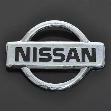 Купити Эмблема "Nissan" пластик/2 пукли/маленькая 50х69мм 21558 Емблеми на іномарки