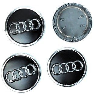 Купить Колпачки на литые диски для Audi 69 х 57 мм объемный логотип с кольцом Черные 4 шт 68473 Колпачки на титаны