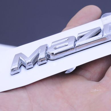 Купить Эмблема надпись Mazda 3 2014-2015 Sedan скотч 3М 140 x 15 мм Польша 22101 Эмблема надпись на иномарки