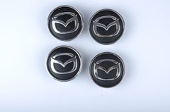 Купить Колпачки на литые диски Mazda 60х55 мм объемный логотип Черные 4 шт 22925 Колпачки на титаны с логотипами