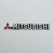 Купити Емблема - напис "MITSUBISHI" (чорний фон) скотч 190х23 мм 22111 Емблема напис на іномарки - 1 фото из 2
