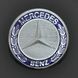 Купити Емблема "Mercedes-714" на капот/2 пукли/пластик/609 D75мм 21533 Емблеми на іномарки - 1 фото из 2